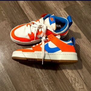 Nike women’s sneakers, with blue and orange accents